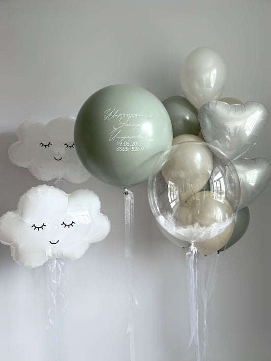 Under the trees balloon set with cloud balloons, feather bubble balloon, and custom sign for baby celebration decor in New York