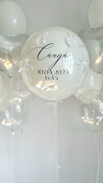 Close-up of white welcome balloon set with personalized double bubble balloon in Brooklyn